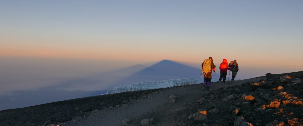 The 6-day Marangu Route, also known as the “Coca-Cola Route,” is the most established and comfortable path to the summit of Mount Kilimanjaro. It is the only route that offers hut accommodations instead of tents, making it a great choice for climbers seeking a bit more comfort. The trail takes you through five diverse ecological zones — from lush rainforest and moorland to alpine desert and the icy summit zone. Along the way, you'll enjoy views of Mawenzi Peak, explore the Maundi Crater, and possibly spot blue monkeys and Colobus monkeys in the forest. The Marangu Route’s gradual ascent profile helps with acclimatization, making it ideal for first-time climbers aiming to reach Uhuru Peak (5,895m) and experience the breathtaking summit sunrise.